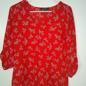Red blouse with white and blue flora details